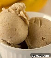 Scoops of roasted banana ice cream in a white bowl.