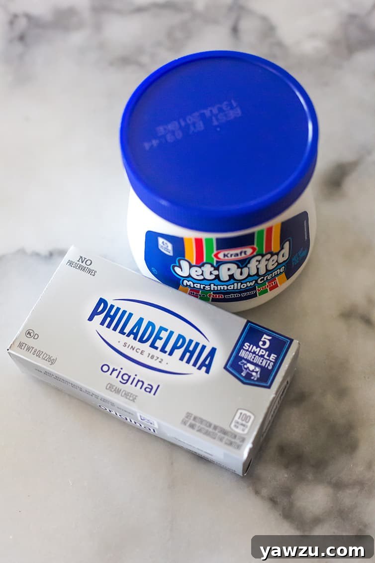 A block of Philadelphia cream cheese with a jar of marshmallow creme.