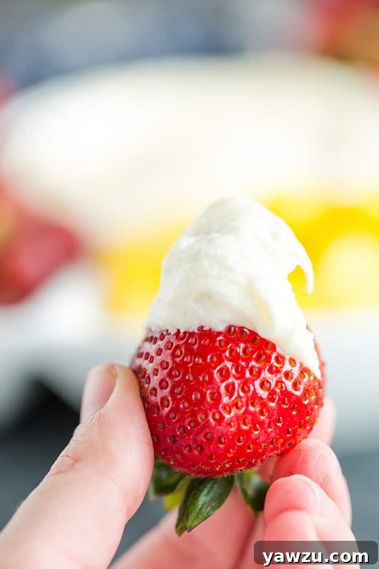 A strawberry with fruit dip.