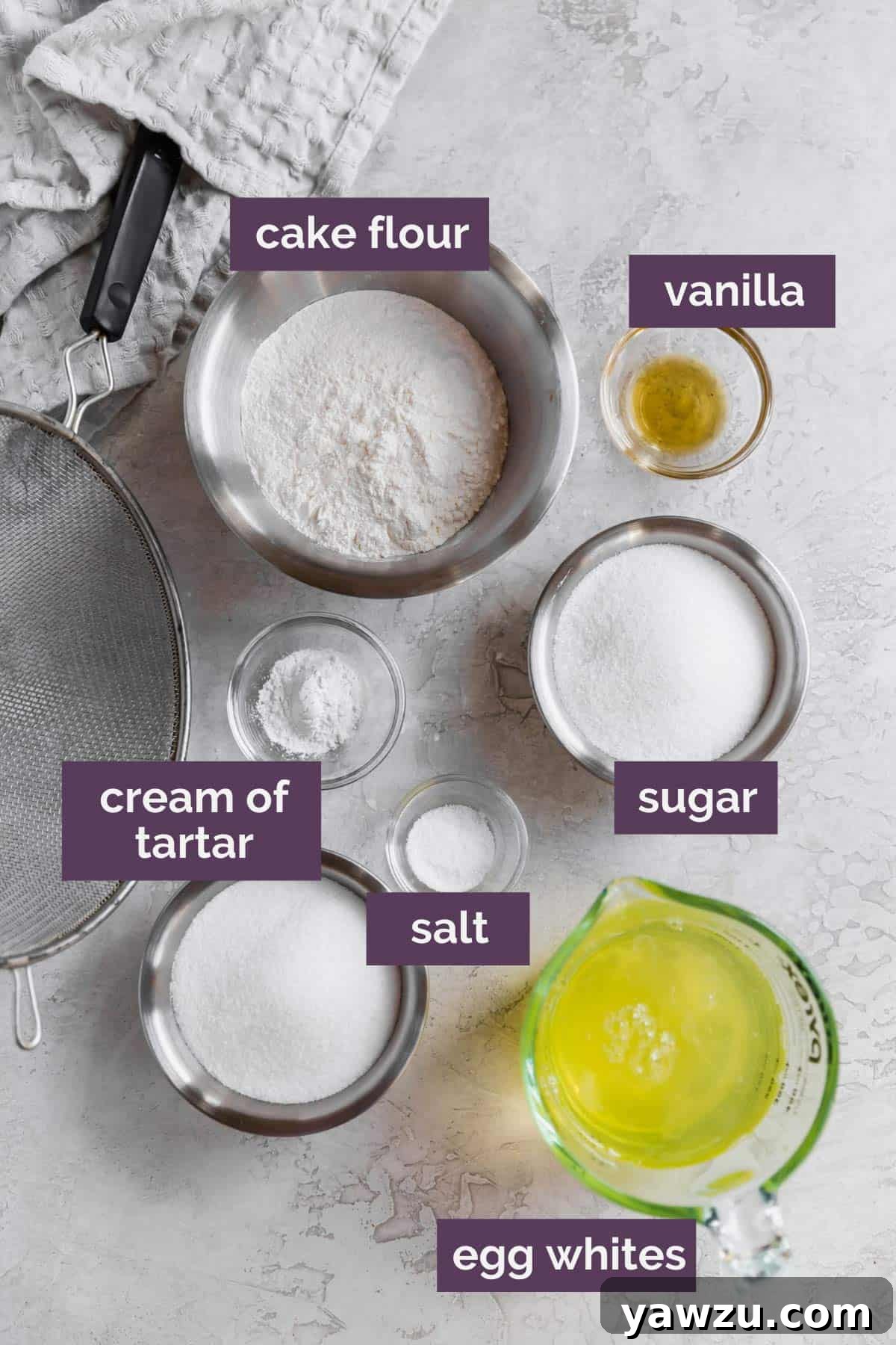 Ingredients for angel food cake prepped and labeled, showcasing the minimal yet essential components.