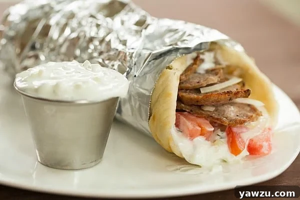 Delicious Greek Lamb Gyros with fresh vegetables and creamy Tzatziki Sauce