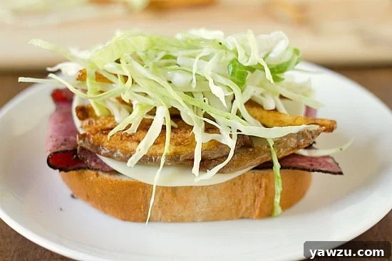 A mound of tangy oil and vinegar coleslaw added on top of the French fries, completing another essential layer of the Primanti Bros. sandwich.