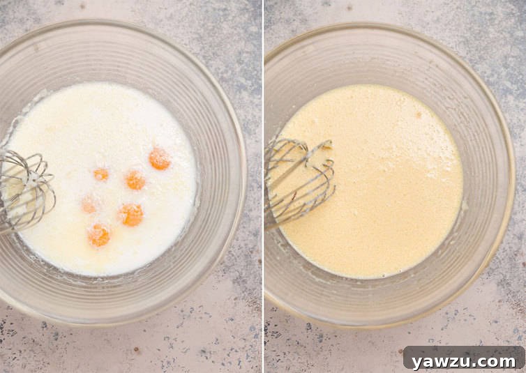 A whisk blending together the creamy custard mixture in a glass bowl, essential for making delicious French toast.