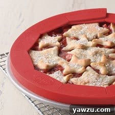 King Arthur Flour Adjustable Silicone Pie Crust Shield, a reusable tool to prevent pie crusts from over-browning.