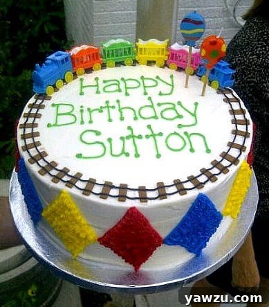 Colorful train themed birthday cake with a vibrant rainbow cake interior