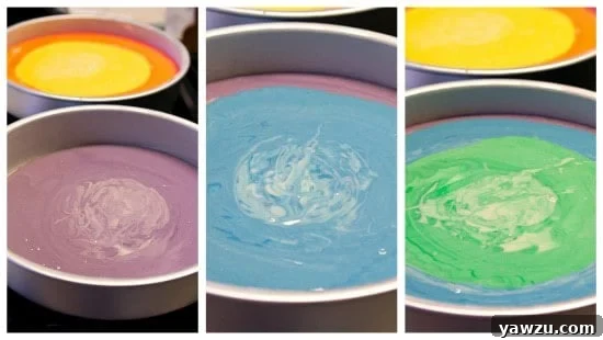 Second cake pan filled with purple, blue, and green cake batter layers, mimicking the rainbow pattern