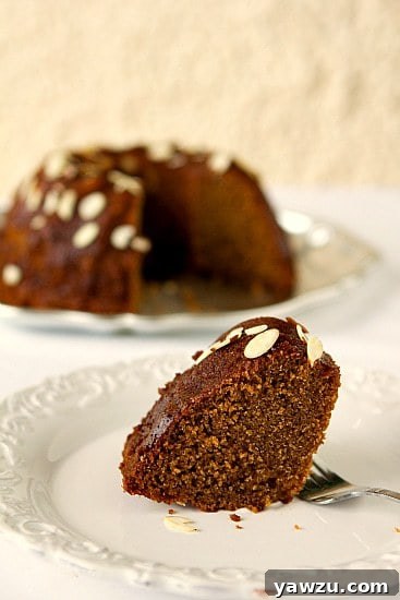 Close-up of a perfectly baked slice of Honey Cake revealing its moist, tender crumb