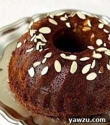 A festive Honey Bundt cake on a silver serving platter.