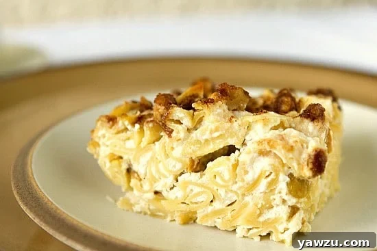 Golden-brown sweet Noodle Kugel baked in a casserole dish, ready for serving.