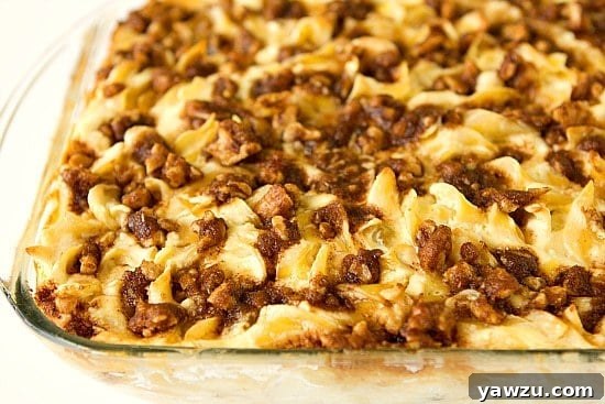 Close-up of a perfectly baked slice of Noodle Kugel, revealing the creamy texture and tender noodles.