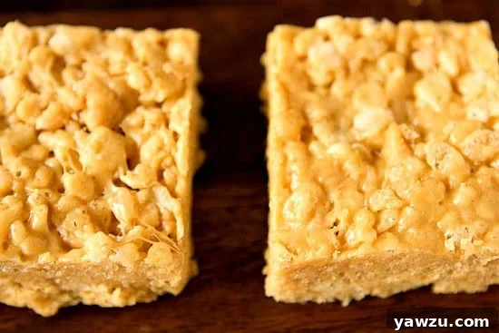 White Chocolate Peanut Butter Rice Krispies Treats ready to be cut