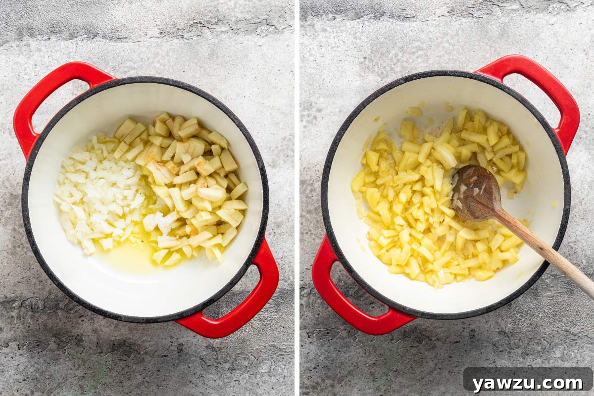 Chopped apple and onions being sauteed in a Dutch oven.