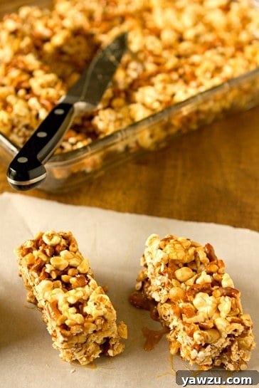 Salted Caramel Popcorn, Pretzel & Peanut Bars, cut into squares and ready to serve