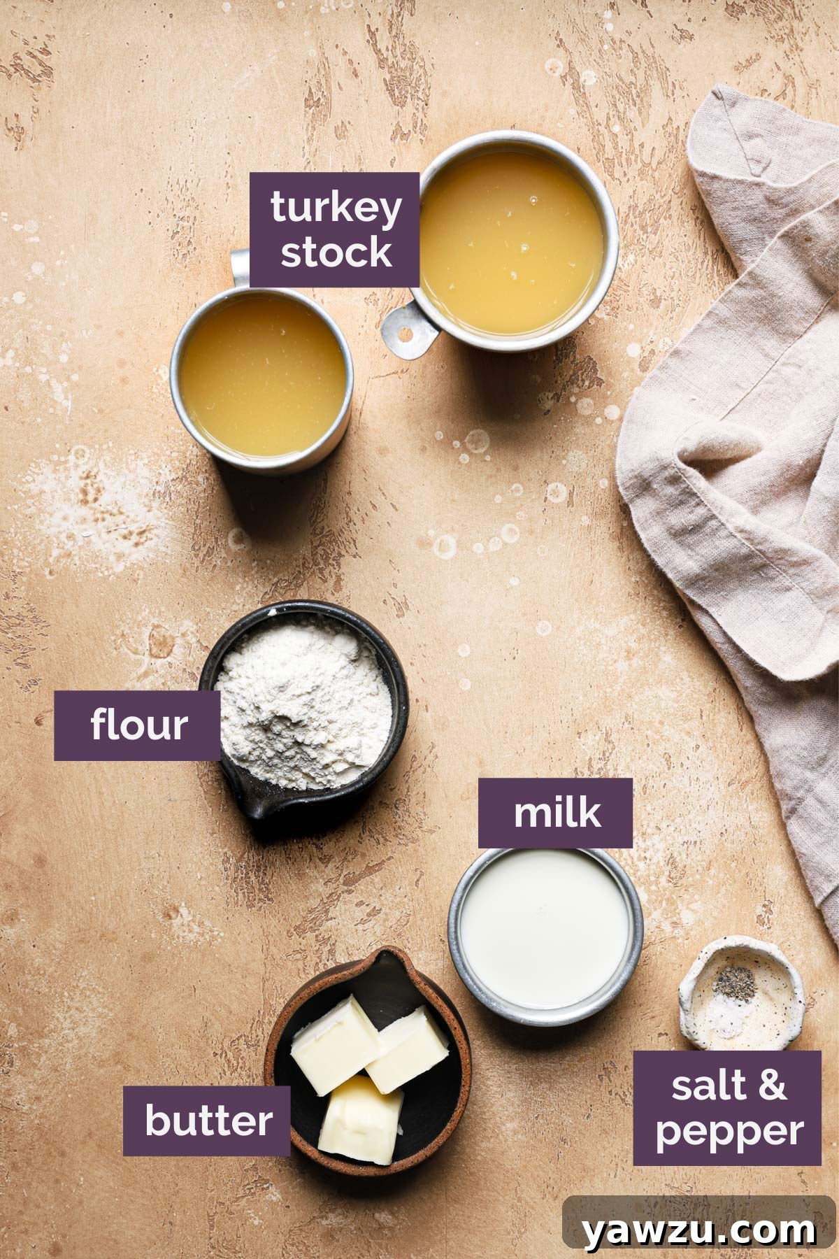 Ingredients for make ahead turkey gravy prepped and labeled on a countertop.