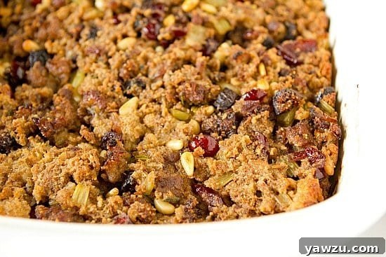 Close-up of baked Sausage, Fig & Cranberry Stuffing, showcasing its rich texture and vibrant fruit components