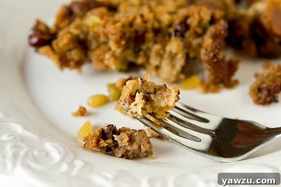 Generous portion of homemade Sausage, Fig & Cranberry Stuffing, beautifully presented in a serving dish