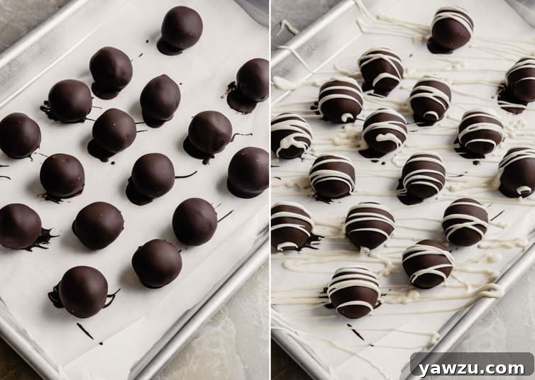 Oreo truffles covered in chocolate and drizzled with white chocolate.