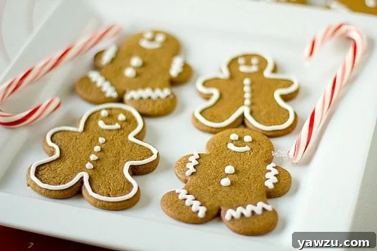 Classic Gingerbread Men Cookies on a white plate, beautifully decorated with icing.