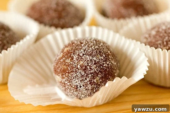 Platter of Chocolate Bourbon Balls coated in powdered sugar