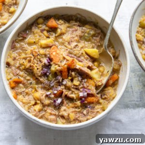 Three bowls of Ham and Split Pea Soup with bowl of chopped onions