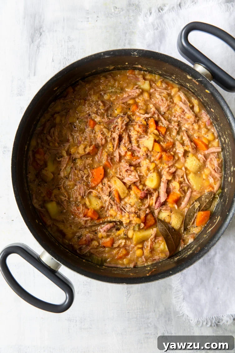 Ham and Split Pea Soup simmering in a Dutch oven