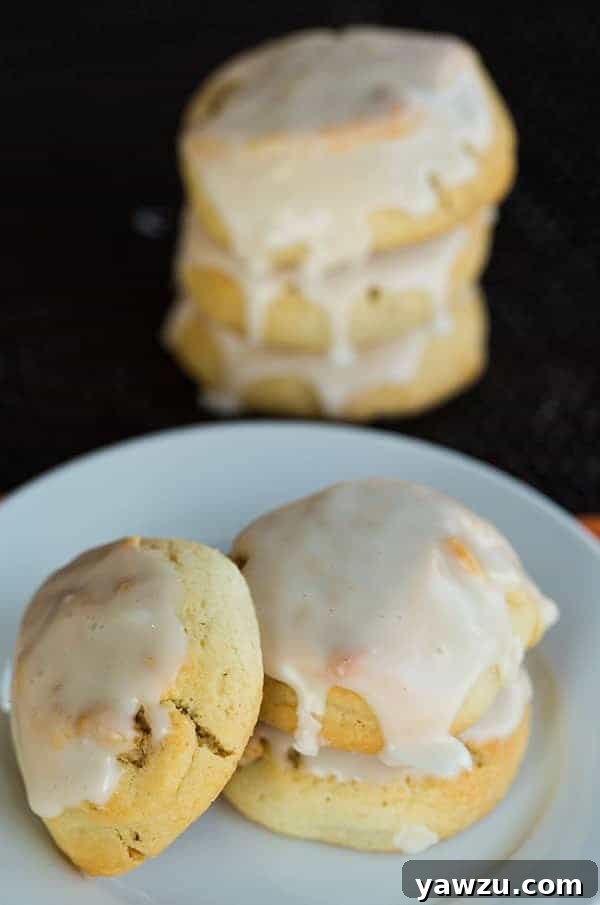 Italian Walnut Pillow Cookies laid out on a baking sheet, ready for icing