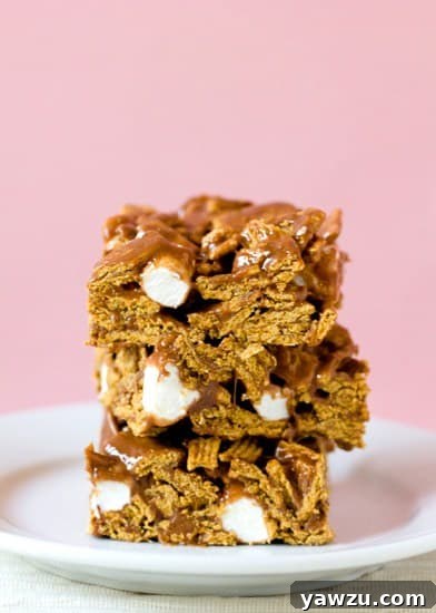 Delicious Golden Grahams S'mores Bars on a white plate