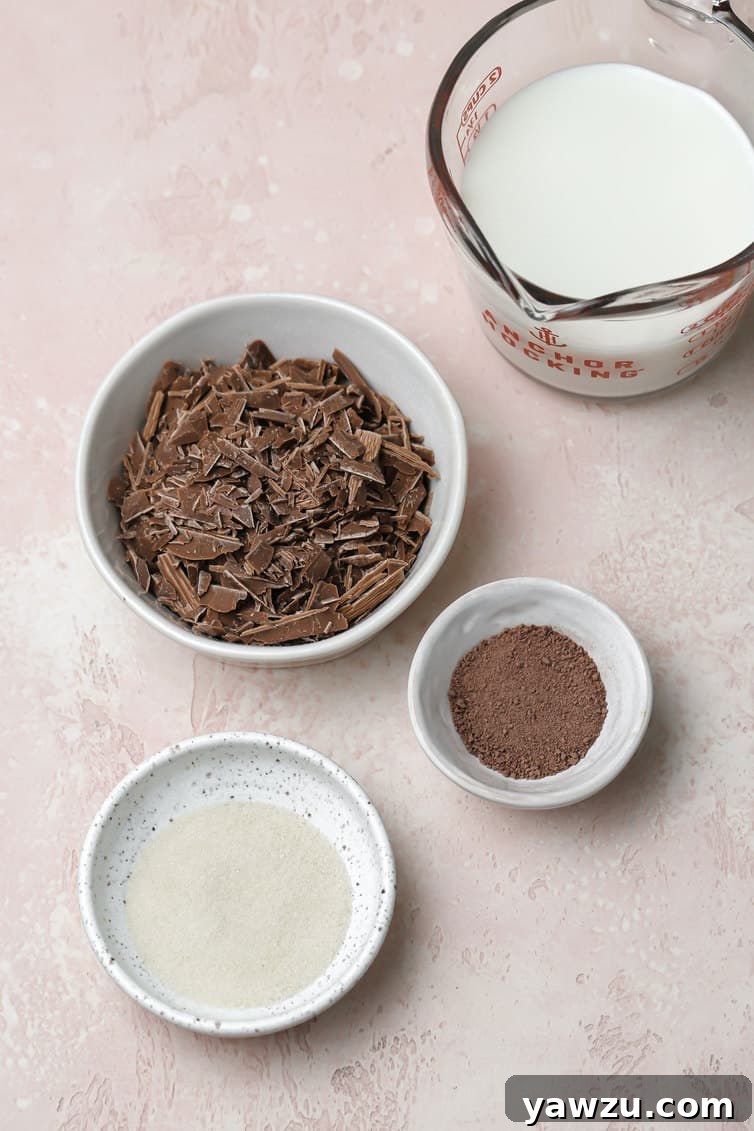 Ingredients for frozen hot chocolate prepped in bowls on counter.