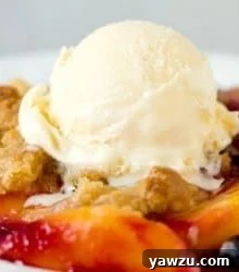 Close-up of baked peach and blueberry crumble