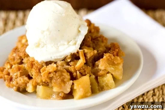 Golden brown Almond-Apple Crisp, fresh from the oven, symbolizing the warmth of autumn baking
