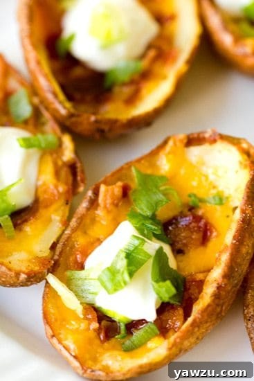 Golden brown potato skins filled with cheese and bacon