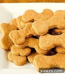 Beef and cheddar dog biscuits on a white serving plate.