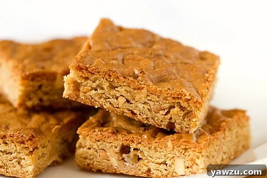 A tray of freshly baked Peanut Butter Blondies, cut into perfect squares.