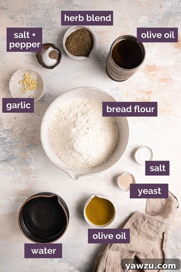 Labeled ingredients for focaccia on a white counter.