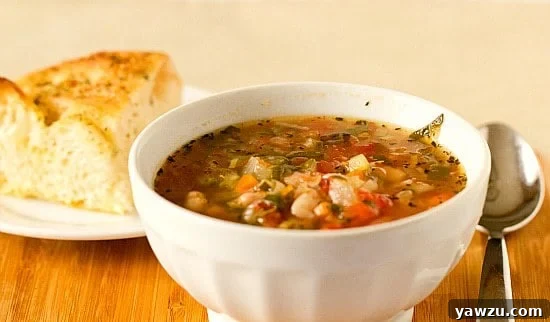 Delicious Minestrone Soup with a rich broth and fresh ingredients.