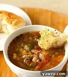 A vibrant bowl of homemade Minestrone Soup with fresh vegetables and a rich broth.