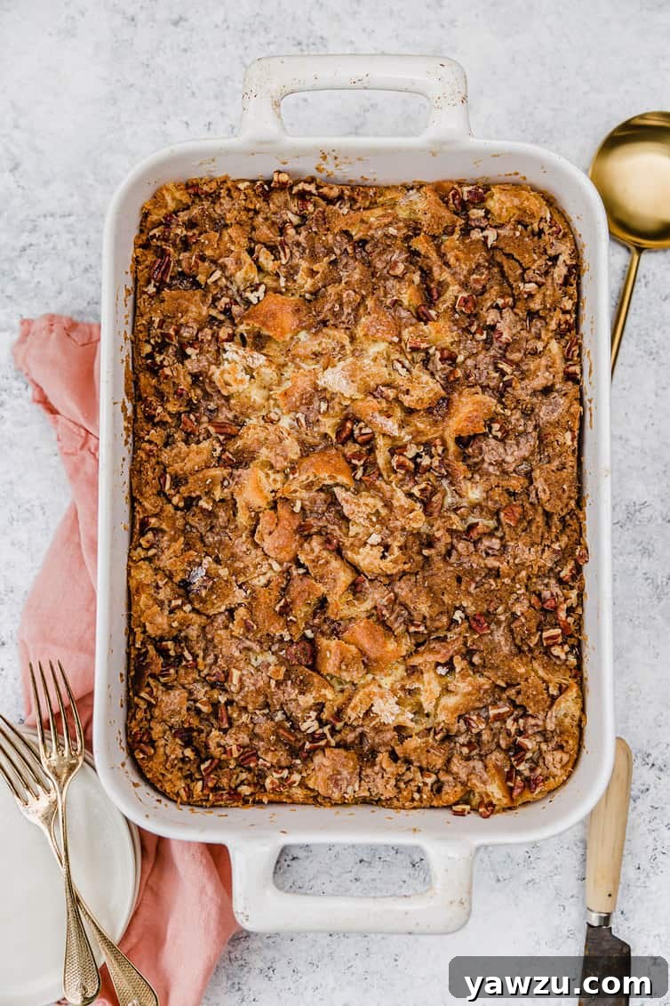 A large casserole of baked French toast with praline topping on a kitchen counter.