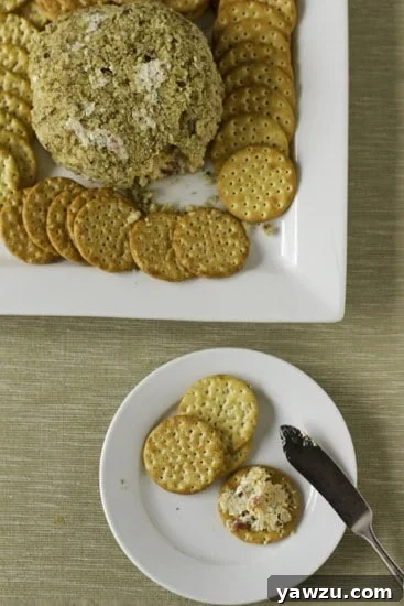 A close-up of the pimiento cheese ball being prepared, showing the texture.