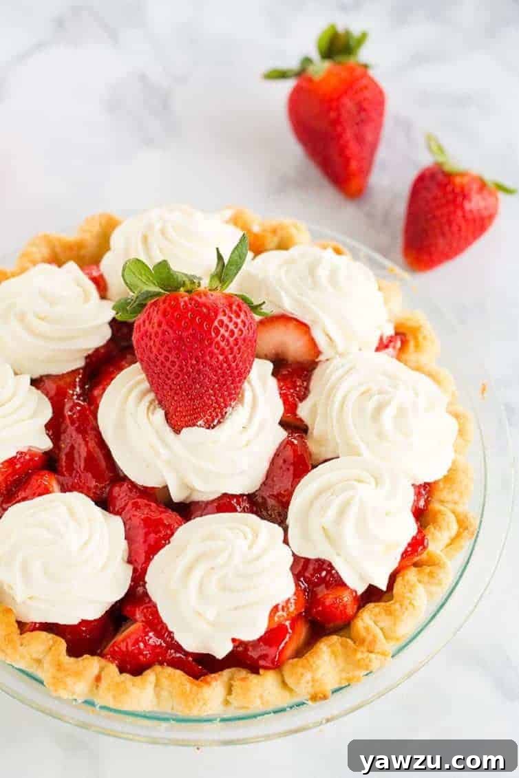 Strawberry Pie - This fresh strawberry pie is 100% homemade from my favorite crust, a delicious glaze, and sweet whipped cream. A perfect summer dessert!