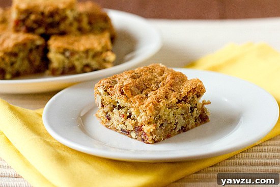 Delicious date bars cooling on a wire rack, with a rustic kitchen background.