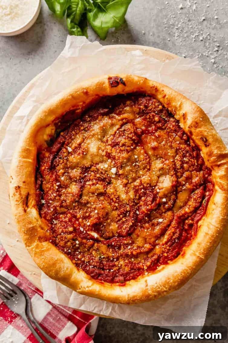 A glorious Chicago-style deep-dish pizza resting on a round pizza stone, with a fork poised to the bottom left, ready to dive into a slice. The golden crust and bubbling sauce are perfectly visible.