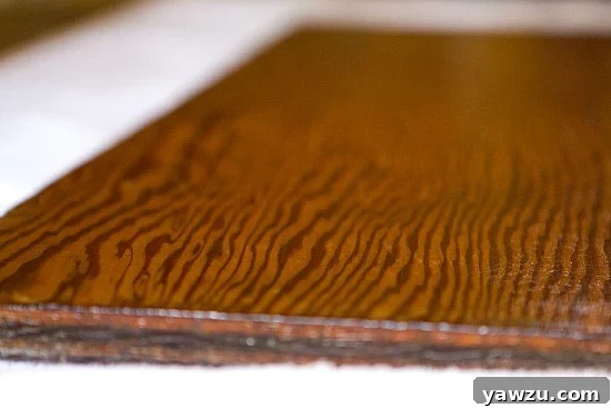 The fully restored wooden dough board showcasing a rich, healthy wood tone, a perfectly sealed, smooth surface, and a subtle sheen