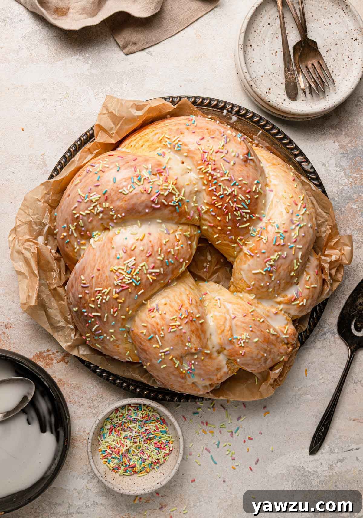 Overhead photo of Italian Easter bread with a light icing glaze and pastel sprinkles.