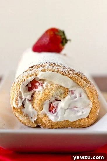 Delightful Strawberries and Cream Angel Food Cake Roll, perfect for spring gatherings.