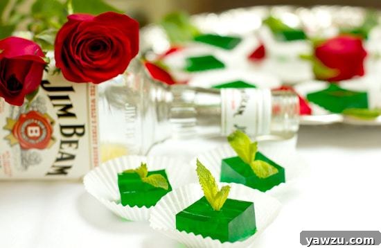 Close-up of Mint Julep Jell-O Shots garnished with fresh mint leaves