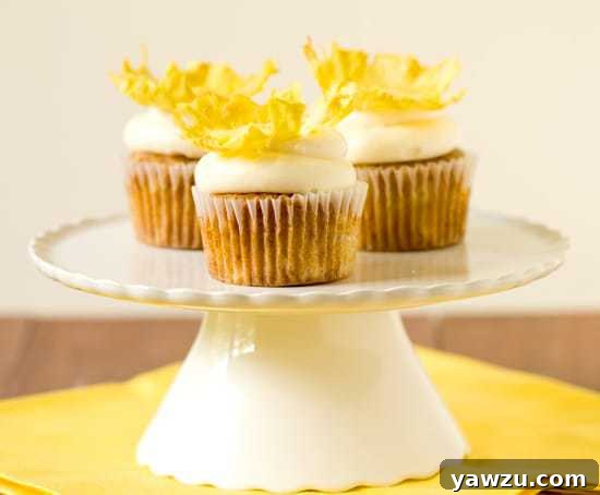 Close-up of a Hummingbird Cupcake with Cream Cheese Frosting and Dried Pineapple Flower