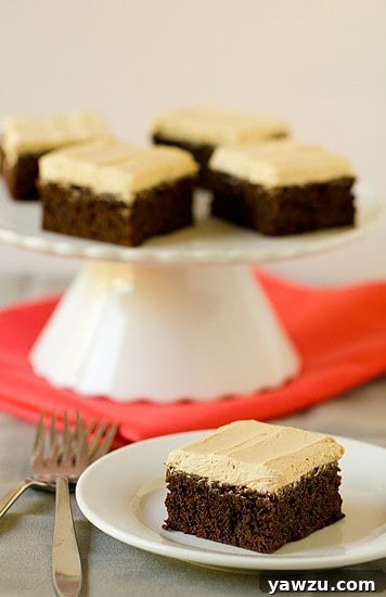 Rich, fudgy mocha brownies topped with fluffy espresso buttercream frosting, ready to be devoured.