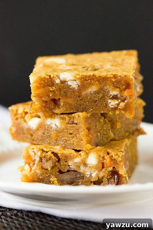 Pumpkin Blondies on a white plate with a fork