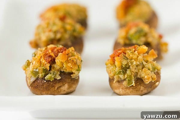 A tray of Mrs. Waterman's Stuffed Mushrooms ready to be baked, showing the generous filling