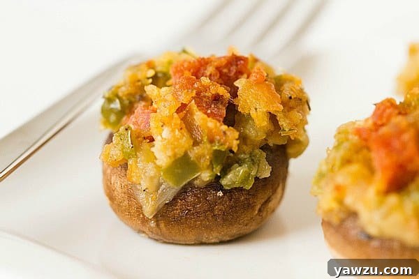 Beautifully arranged baked stuffed mushrooms on a serving platter, ready for guests